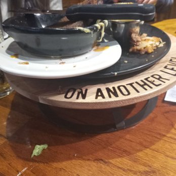 Outback Steakhouse - Never cleared table.  Dishes just kept piling up - Steakhouses Near Me - Cape Girardeau, Missouri