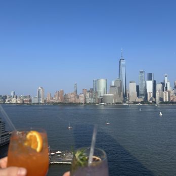 RoofTop at the Exchange Place - Lavender Spritz and Selling Sunset Spritz - New American Near Me - Jersey City, New Jersey RoofTop at the Exchange Place - Lavender Spritz and Selling Sunset Spritz - New American Near Me - Jersey City, New Jersey