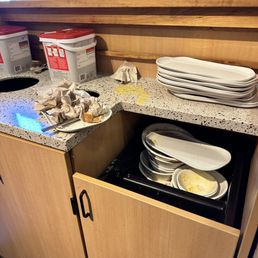 a stack of plates in a kitchen