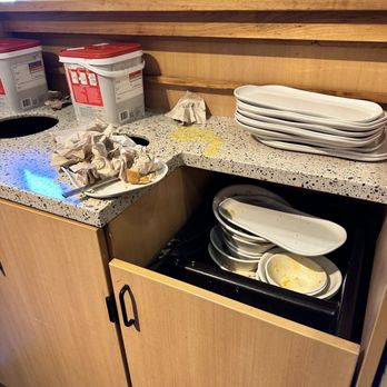 Panera Bread - a stack of plates in a kitchen - Sandwiches Near Me - Roanoke, Virginia