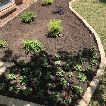 Duncan Tree & Landscape - Flower bed - Garage Door Services Near Me
