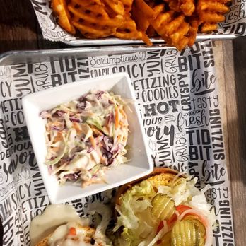 The Burger Joint - a plate of fries and a sandwich - Burgers Near Me - Indianapolis, Indiana
