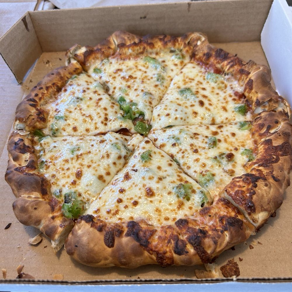 Ten inch Chicago style pizza from The Dough Shop with pepperoni and green peppers. Ten inch Chicago style pizza from The Dough Shop with pepperoni and green peppers.
