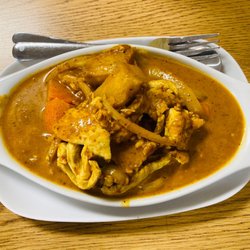 Cafe MeKong - Massaman (Yellow) Curry: Yellow Curry with Potatoes, Onion, Carrots, Coconut Milk, and Roasted Peanuts with Chicken.