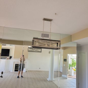 R & L Services - Picture of entry way where floor begins in living room dining room area. - Painters Near Me - Cathedral City, California