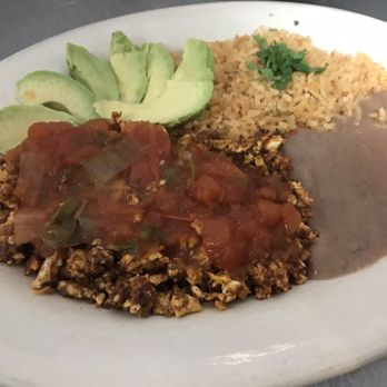 Taqueria El Charro - Special Made Breakfast Plate- Huevo Con Chorizo with salsa ranchera; rice,beans and avocado on the side - Mexican Near Me - Houston, Texas Taqueria El Charro - Special Made Breakfast Plate- Huevo Con Chorizo with salsa ranchera; rice,beans and avocado on the side - Mexican Near Me - Houston, Texas
