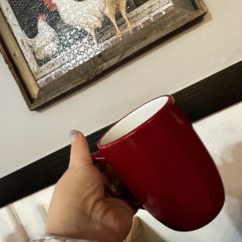 Early Bird Cafe - a hand holding a red coffee cup - American Near Me - Pine, Arizona
