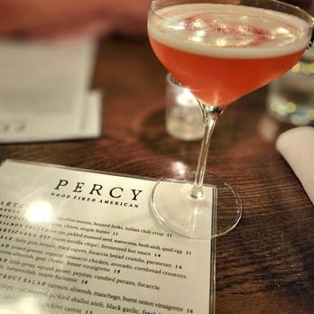 Percy - a cocktail in a coupe glass on a table - Desserts Near Me - Boise, Idaho Percy - a cocktail in a coupe glass on a table - Desserts Near Me - Boise, Idaho