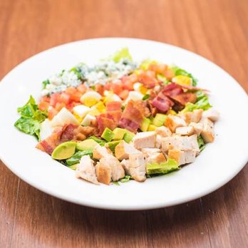Smitty's - a salad with chicken, lettuce, tomatoes, corn, and bacon - Canadian (New) Near Me - Winnipeg, Manitoba