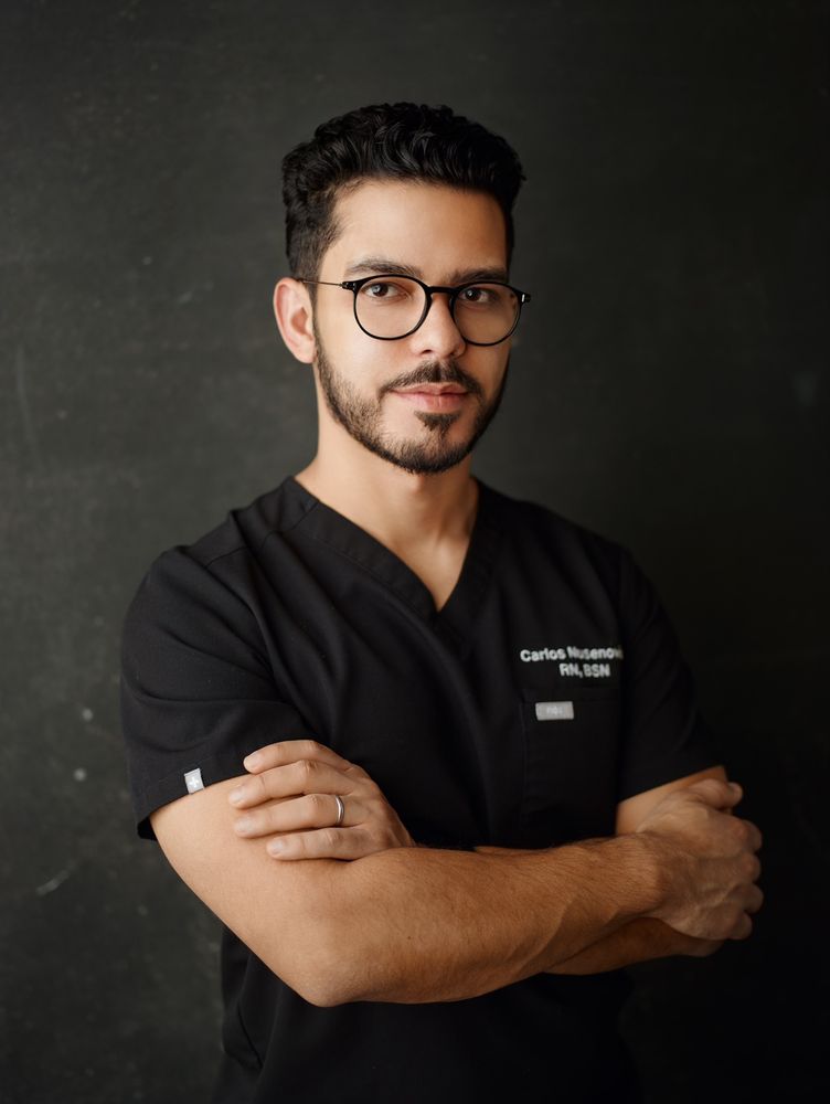 Carlos Nusenovich, RN Logo