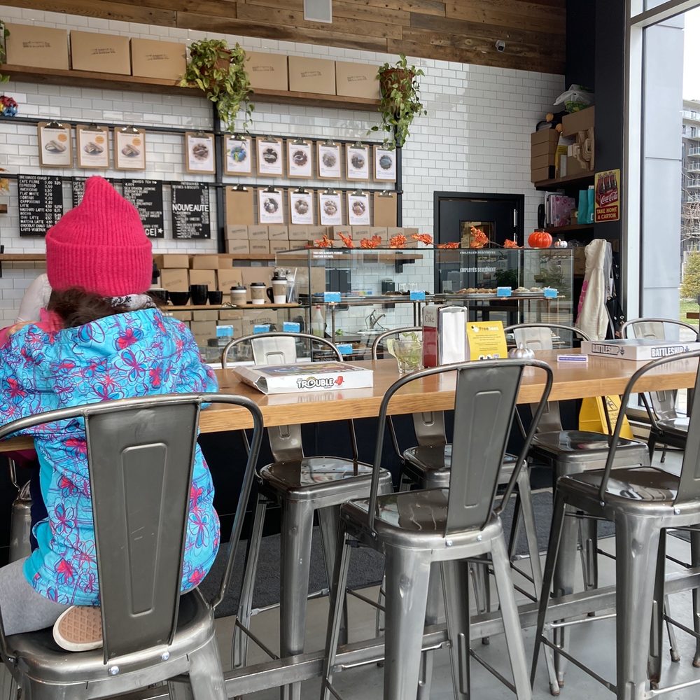 a woman sitting at a counter a woman sitting at a counter
