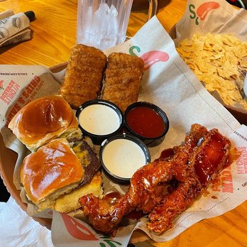 Chili's - Triple dipper with mozzarella sticks, sliders, and honey chipotle chicken crispers. (and my empty water...) - Bars Near Me - Cincinnati, Ohio