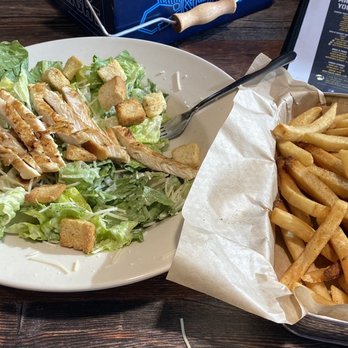 Mr Brews Taphouse - Melbourne - Good vs. Evil. Grilled Chicken Caesar Salad with a basket of Fries. - Beer Bar Near Me - Melbourne, Florida