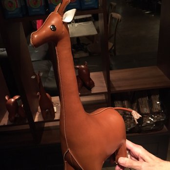 Vaudeville - They sell little knick knacks like this $80 weighted leather giraffe. - New American Near Me - Fredericksburg, Texas