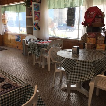Luv More Ice Cream - Tables, some with checkers to play. - Ice Cream & Frozen Yogurt Near Me - Marlette, Michigan