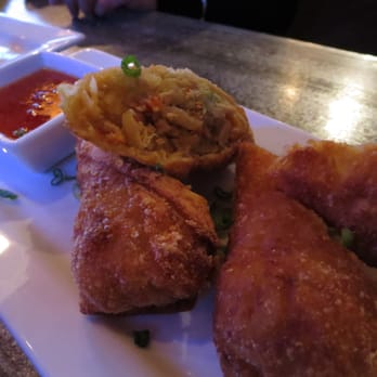 Industry Tavern - Egg Rolls - ginger chicken, napa cabbage, avocado, sweet chili sauce. - New American Near Me - Atlanta, Georgia Industry Tavern - Egg Rolls - ginger chicken, napa cabbage, avocado, sweet chili sauce. - New American Near Me - Atlanta, Georgia