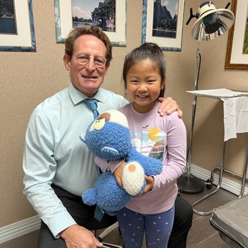 Mark Reed, DPM DABFAS - Dr. Reed with a patient - Podiatrists Near Me - Placentia, California Mark Reed, DPM DABFAS - Dr. Reed with a patient - Podiatrists Near Me - Placentia, California