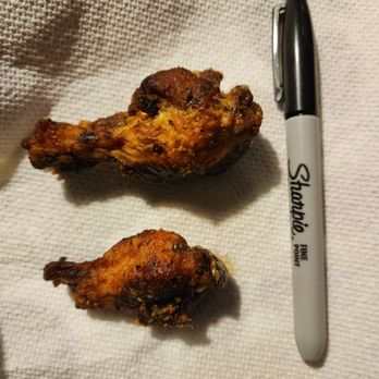 Woodie's Wings - Extremely small drummette next to a "regular" sized one. Sharpie for size comparison. - Chicken Wings Near Me - Oswego, Illinois Woodie's Wings - Extremely small drummette next to a "regular" sized one. Sharpie for size comparison. - Chicken Wings Near Me - Oswego, Illinois