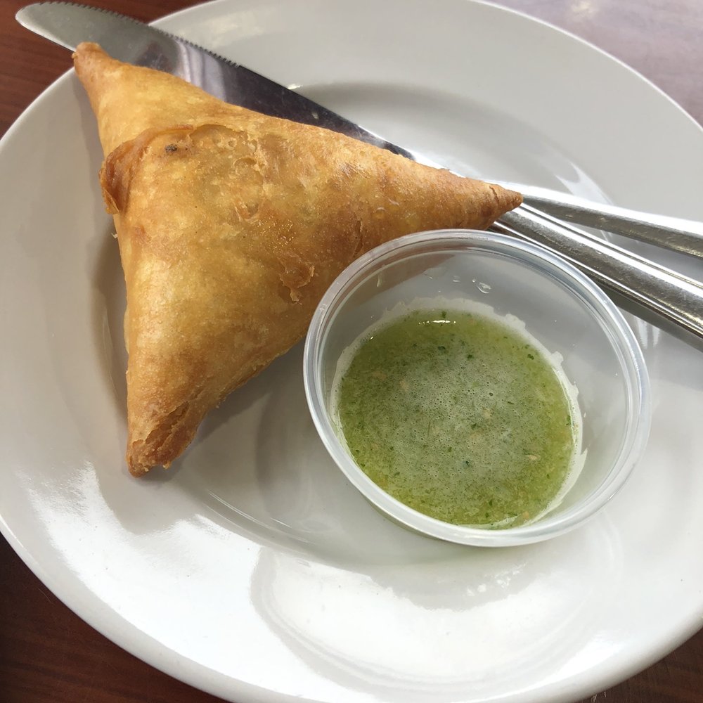 Fatima's Cafe - Beef samosa with hot sauce. SO GOOD! - African Near Me - Worcester, Massachusetts Fatima's Cafe - Beef samosa with hot sauce. SO GOOD! - African Near Me - Worcester, Massachusetts