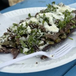 Taqueria Mis Chilangos - Tlacoyos (Masa Azul) BLUE DOUGH Prepared Cactus,Sour cream, Cheese, Cilantro and Onion, and we added beef!