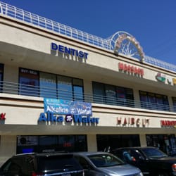 Merceditas R Sinsioco DDS - 2nd Floor, in between a massage place and a realty office.