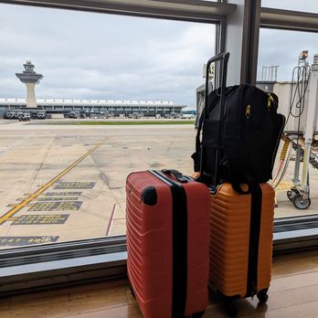 Virgin Atlantic Lounge - luggage in front of a window - Airport Lounges Near Me - Dulles, Virginia Virgin Atlantic Lounge - luggage in front of a window - Airport Lounges Near Me - Dulles, Virginia