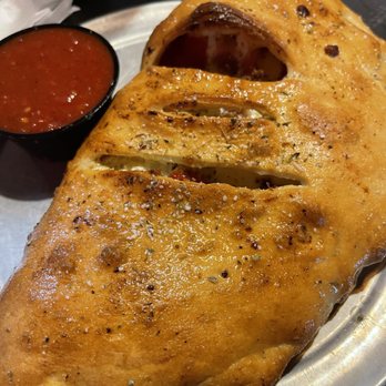 Pizza Joint - Chauvinistic Pig Calzone - Pizza Near Me - Augusta, Georgia Pizza Joint - Chauvinistic Pig Calzone - Pizza Near Me - Augusta, Georgia