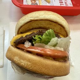 Cheeseburger w/ whole grilled onion & chopped chilis Cheeseburger w/ whole grilled onion & chopped chilis