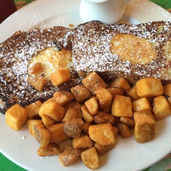 Papermoon Diner - Forget the name. Eggs in a sunflower toast with home fries. Tasty! - Diners Near Me - Baltimore, Maryland