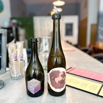 The Aventine - two bottles of wine on a counter - Wine Bars Near Me - Asheville, North Carolina The Aventine - two bottles of wine on a counter - Wine Bars Near Me - Asheville, North Carolina