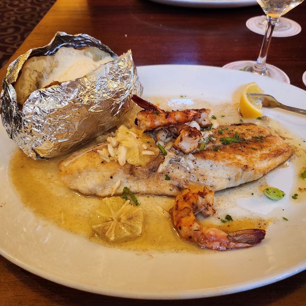 Pappadeaux Seafood Kitchen - Red fish with shrimp and crawfish on top and baked potato the sauce was everything - Seafood Near Me - Austin, Texas