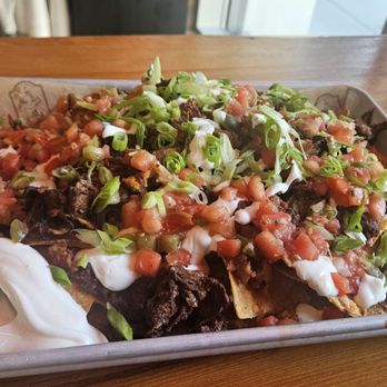 The Redd Dog - Gnarly Nachos with few extras added - Pubs Near Me - Bellevue, Washington The Redd Dog - Gnarly Nachos with few extras added - Pubs Near Me - Bellevue, Washington