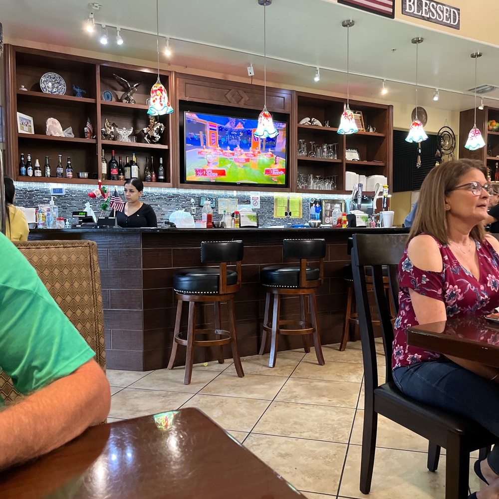two people sitting at a table two people sitting at a table