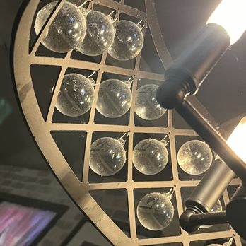 Rim Tanon - Dusty light fixture in the booth - Thai Near Me - Houston, Texas Rim Tanon - Dusty light fixture in the booth - Thai Near Me - Houston, Texas