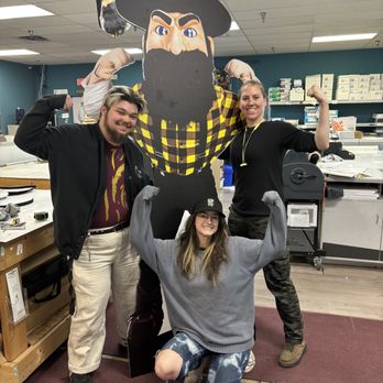 Go Postal in Boone - Design/Production team stands with a larger than life custom Yosef stand up we made for AppState. Remeber: We are an AppState Licensed Print - Shipping Centers Near Me - Boone, North Carolina Go Postal in Boone - Design/Production team stands with a larger than life custom Yosef stand up we made for AppState. Remeber: We are an AppState Licensed Print - Shipping Centers Near Me - Boone, North Carolina
