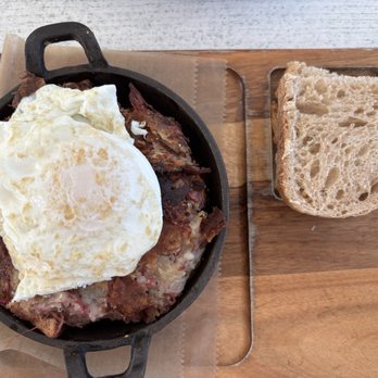 Benny's On The Beach - Pier - Corned beef skillet. Looks good but nothing great. Lacked seasoning and flavor. - Seafood Near Me - Lake Worth Beach, Florida Benny's On The Beach - Pier - Corned beef skillet. Looks good but nothing great. Lacked seasoning and flavor. - Seafood Near Me - Lake Worth Beach, Florida