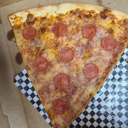 Soggy Pepperoni slice with a skimpy amount of pepperoni. Yum!