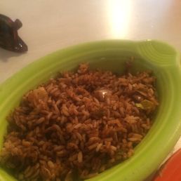 a green bowl of rice and a red plate a green bowl of rice and a red plate