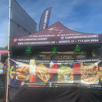 Tisoy Curryative Cuisines - Side of their tent. - Caterers Near Me