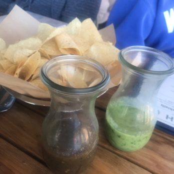Superica - Two types of salsa: green is mild and sour. Darker is spicy - Tex-Mex Near Me - Houston, Texas Superica - Two types of salsa: green is mild and sour. Darker is spicy - Tex-Mex Near Me - Houston, Texas