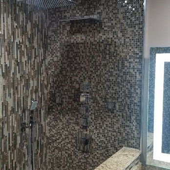 MGM Plumbing - Another custom shower with body sprays handheld shower head over the ceiling and waterfall along with a steam unit - Plumbing Near Me - Sunrise, Florida