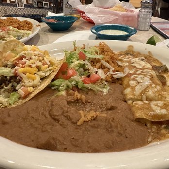 Chuy's - Crunchy beef taco and cheese enchilada topped with green chile sauce (closest to Colorado green chile as I've had, without the pork). - Tex-Mex Near Me - Lutz, Florida Chuy's - Crunchy beef taco and cheese enchilada topped with green chile sauce (closest to Colorado green chile as I've had, without the pork). - Tex-Mex Near Me - Lutz, Florida