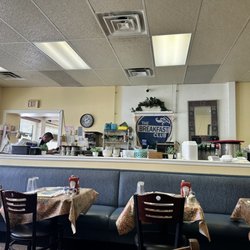 Breakfast Club - Crap alllll over the counters.  Junked up.  Why do you need every condiment on every table?  Junk junk junk.  Old and run down.  Period!