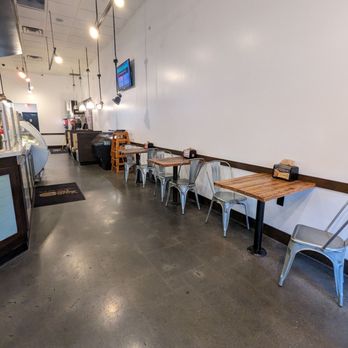 Your Pie - the inside of a restaurant with tables and chairs - Italian Near Me - Lawrenceville, Georgia Your Pie - the inside of a restaurant with tables and chairs - Italian Near Me - Lawrenceville, Georgia