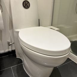 One-piece Kohler Saile toilet, professionally reset by Chris after it had become loose from one of its hidden mounting brackets. One-piece Kohler Saile toilet, professionally reset by Chris after it had become loose from one of its hidden mounting brackets.