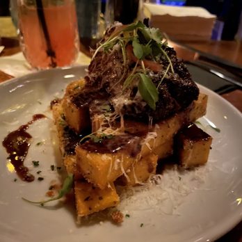 The Blind Rabbit - Braised short rib on top of polenta fries - Cocktail Bars Near Me - Anaheim, California The Blind Rabbit - Braised short rib on top of polenta fries - Cocktail Bars Near Me - Anaheim, California