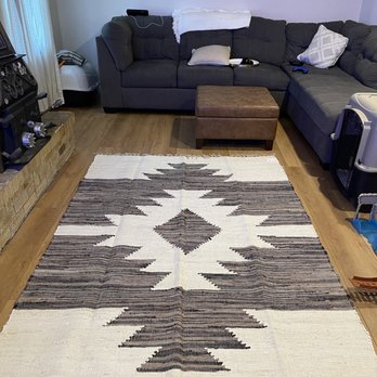 James LoBello Hardwoods - a living room with a couch and a rug - Flooring Near Me James LoBello Hardwoods - a living room with a couch and a rug - Flooring Near Me