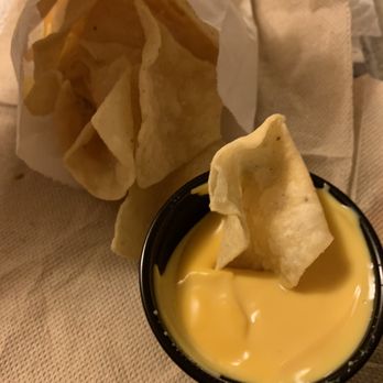 Taco Bell - Nacho chips and cheese dip - Mexican Near Me - Mississauga, Ontario Taco Bell - Nacho chips and cheese dip - Mexican Near Me - Mississauga, Ontario