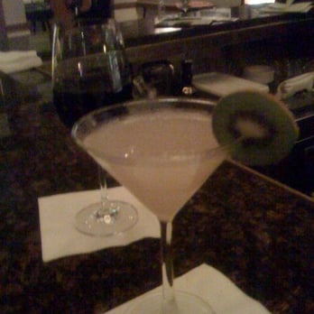 TRAPS Lounge - a martini with a green olive garnish on the rim - New American Near Me - Pebble Beach, California