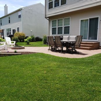 G-Cat Construction - a patio with a table and chairs - General Contractors Near Me - Hoffman Estates, Illinois